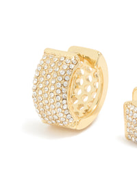 Showcasing gold plated diamante pavé medium huggie earrings with cubic zirconia detailing close up view - link has visual effect only