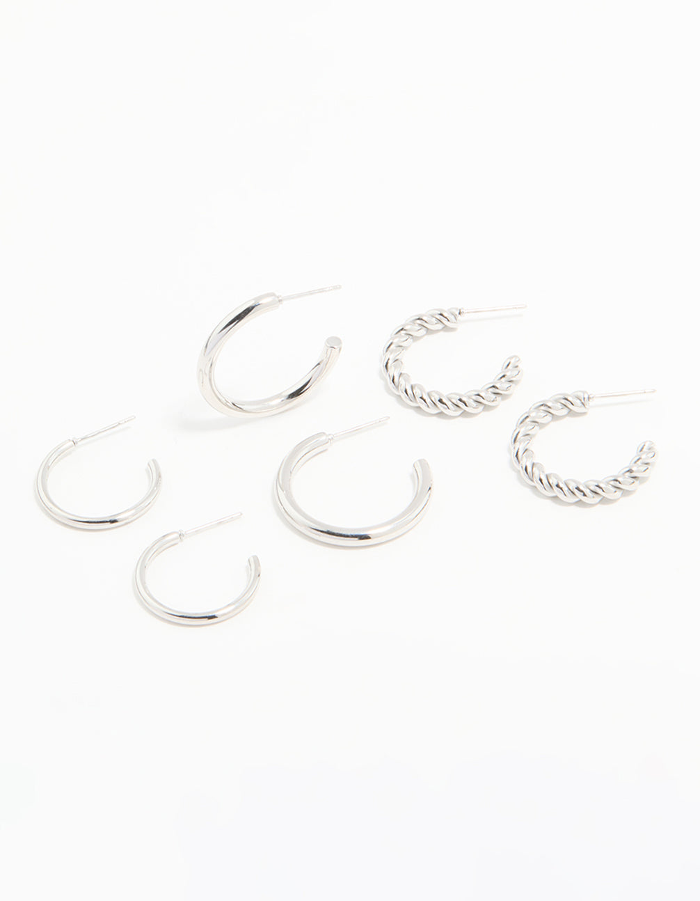 Discover waterproof stainless steel twisted and smooth hoop earrings in a 3-pack with silver tone front view