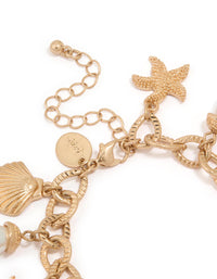 Worn Gold Starfish & Shell Pearl Bracelet - link has visual effect only
