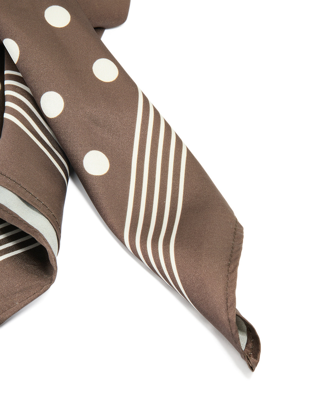 Close-up of polka dot scarf featuring striped corner detail in rosy brown and ivory detail view