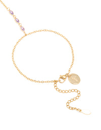 Crafted from waterproof gold plated stainless steel cubic zirconia hand chain bracelet closure detail view - link has visual effect only