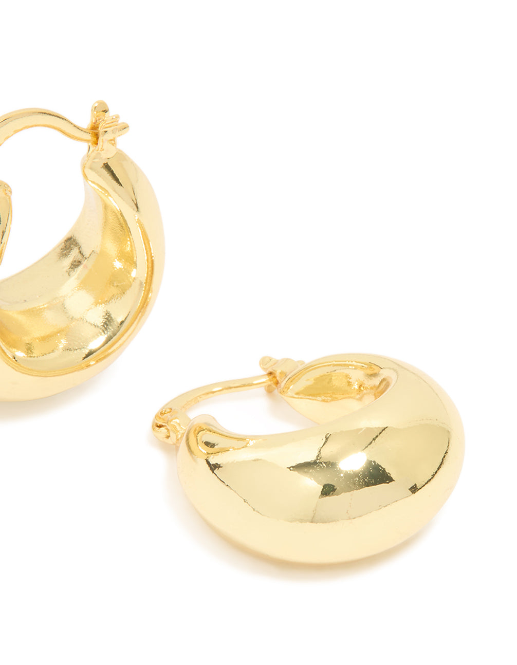Revealing gold plated brass medium huggie earrings with fastening detail post detail view