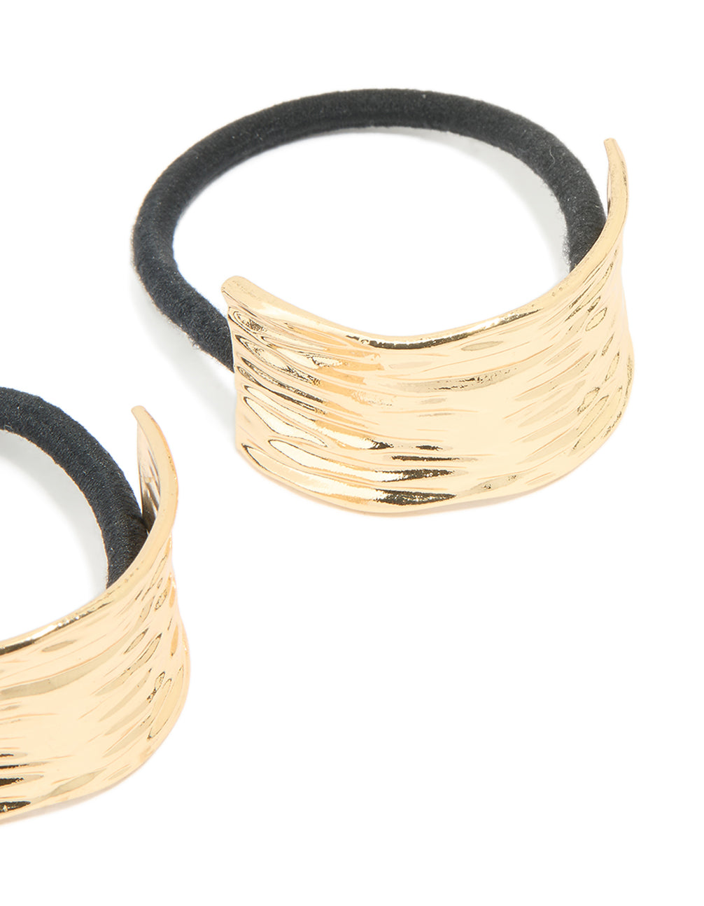 Showcasing gold textured curved hair ties in a 2-pack with black elastic bands detail view