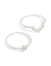 Featuring silver plated cubic zirconia dainty flower and band stacking rings 3-pack with white close up view - link has visual effect only