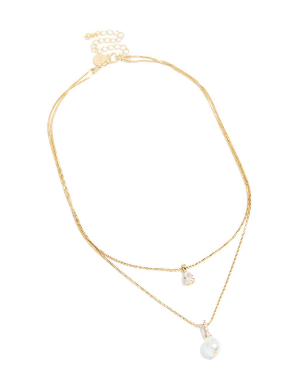 Featuring a gold plated cubic zirconia pearl layered necklace front view