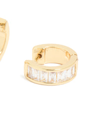 Displaying gold plated cubic zirconia inlay huggie earrings with white baguette stones and closure detail view - link has visual effect only