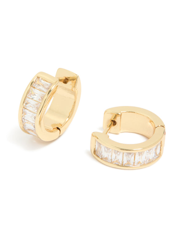 Showcasing gold plated cubic zirconia inlay huggie earrings with white baguette stones in a polished finish front view