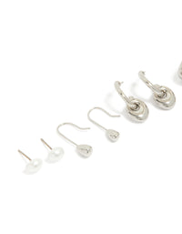 Showcasing silver pearl and multi orb stud earrings 6-pack with dainty designs close up view - link has visual effect only
