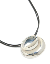 Showcasing a silver boho pendant cord necklace featuring statement design in black close up view - link has visual effect only
