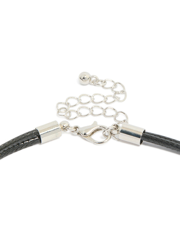 Highlighting a silver boho pendant cord necklace with statement design in black clasp detail view