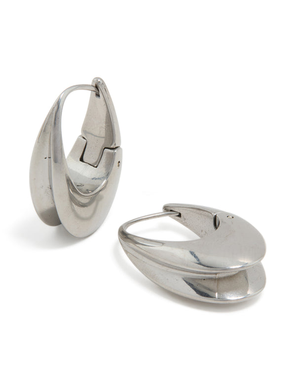 Showcasing waterproof stainless steel oval concave huggie earrings in silver front view