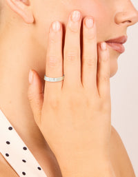 Featuring waterproof stainless steel with cubic zirconia accents, this thin trio rings 3-pack in silver and clear stone on finger view - link has visual effect only