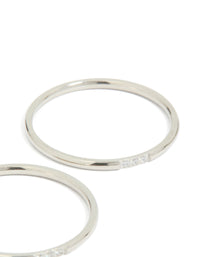 Showcasing waterproof stainless steel construction, this thin cubic zirconia trio rings 3-pack in silver and clear stone close up view - link has visual effect only
