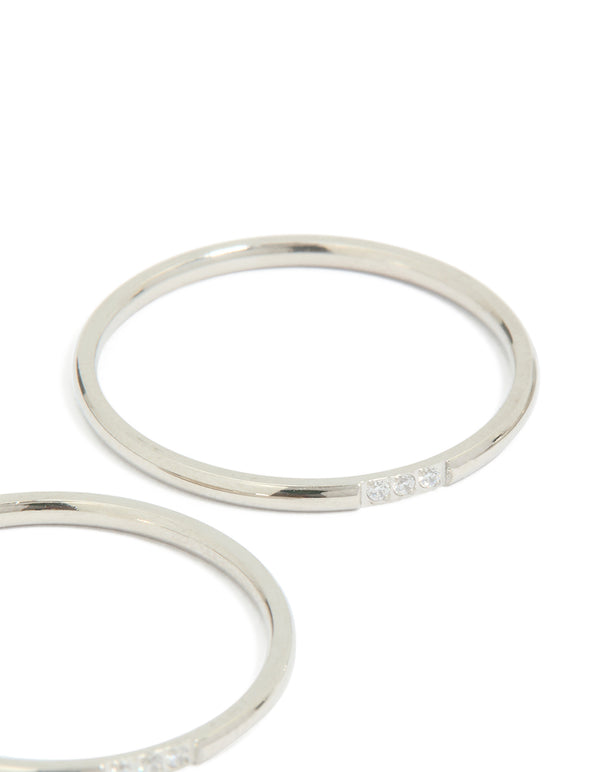 Showcasing waterproof stainless steel construction, this thin cubic zirconia trio rings 3-pack in silver and clear stone close up view