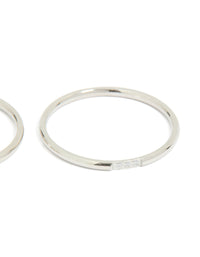Highlighting waterproof stainless steel material, this thin cubic zirconia trio rings 3-pack in silver and clear stone side detail view - link has visual effect only