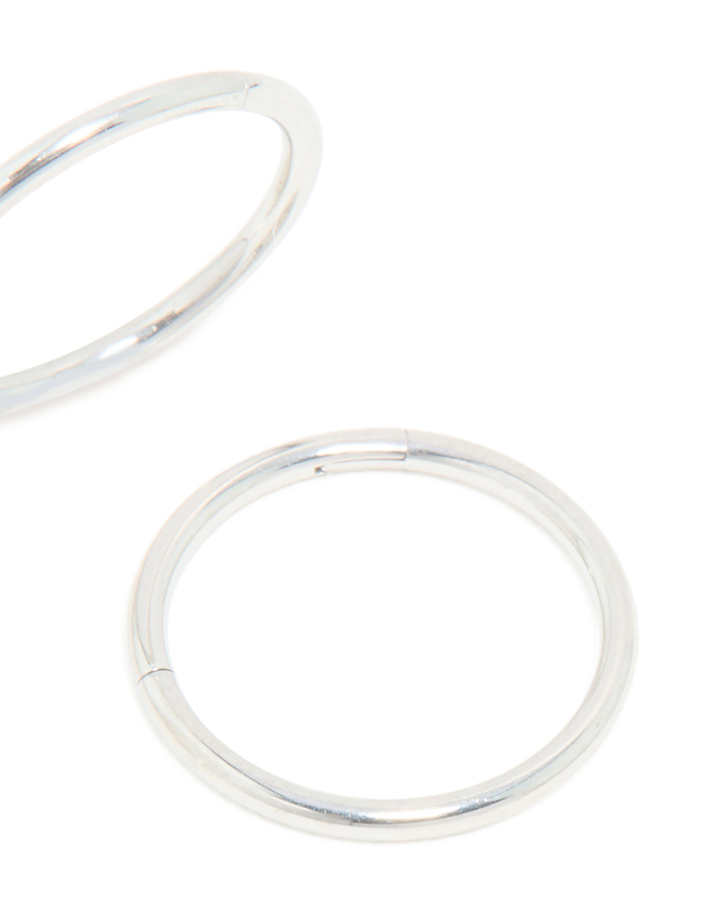 Featuring kids surgical steel sleeper hoop earrings with silver finish post detail view