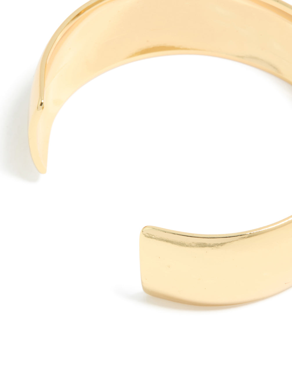 Displaying a waterproof thick open wrist cuff crafted from stainless steel with statement styling in gold plated finish closure detail view