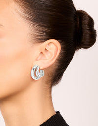 Showcasing waterproof gold plated stainless steel triple illusion hoop earrings with statement style in silver on ear view - link has visual effect only