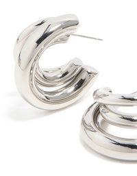 Highlighting waterproof gold plated stainless steel triple illusion hoop earrings with statement finish in silver close up view - link has visual effect only