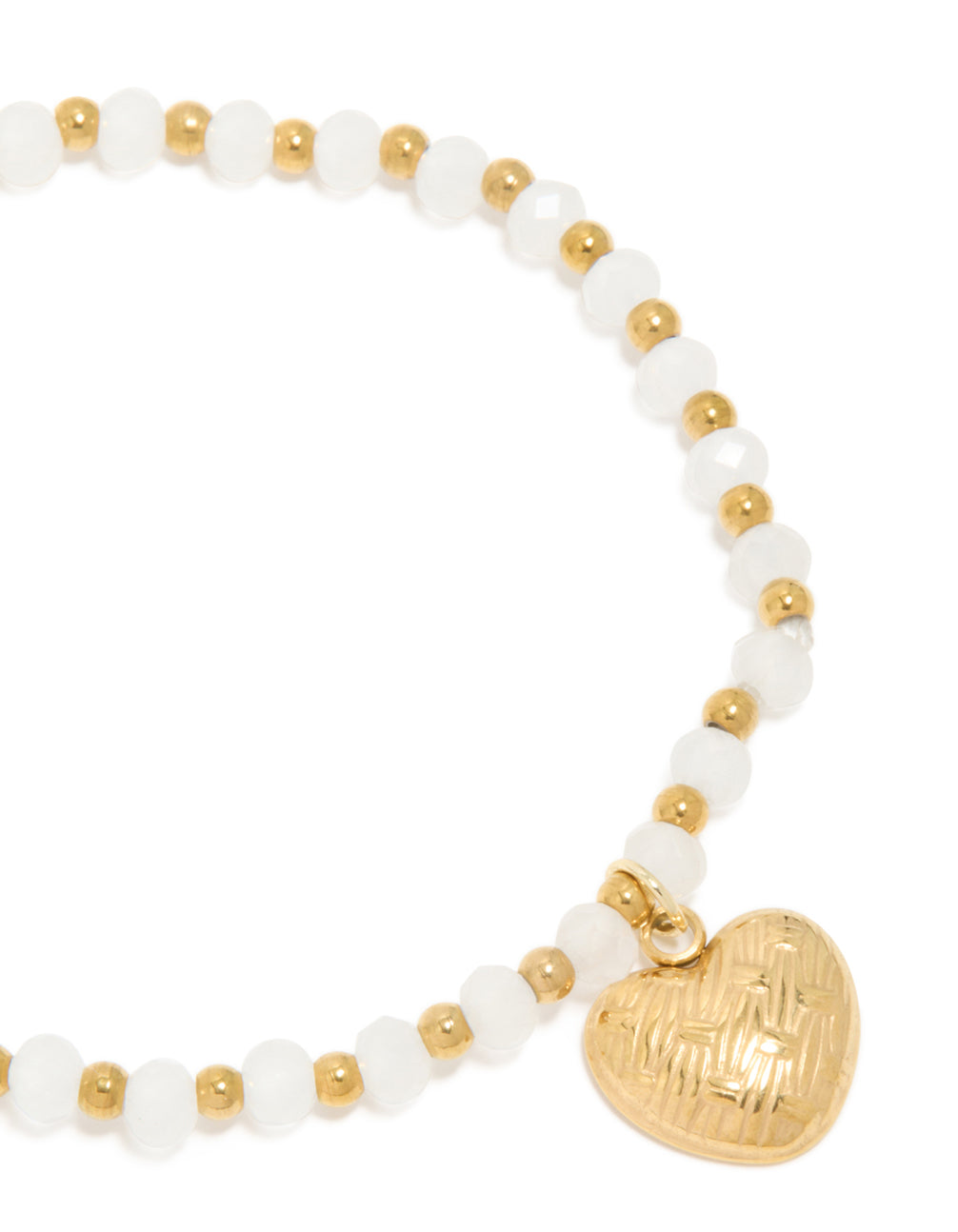 Detailed view of waterproof gold plated stainless steel beaded bracelet with textured heart and white semi precious stones close up view
