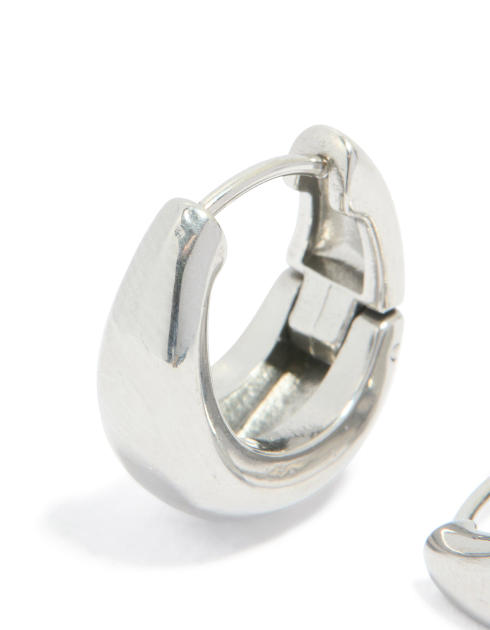 Designed with surgical steel bold oval hoop earrings in silver close up view