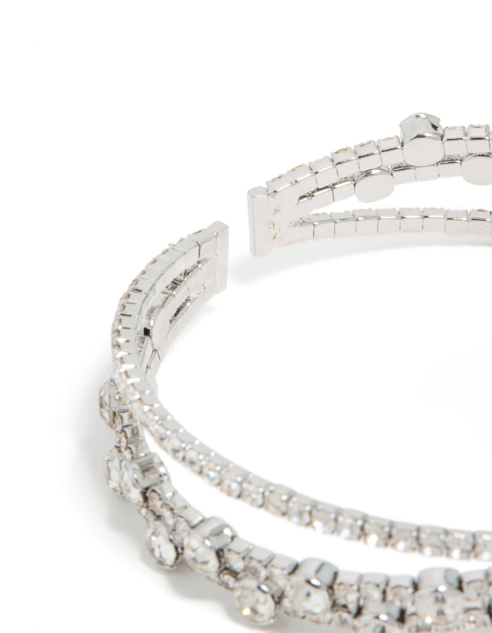 Detailed view of silver diamante crossed circle wrist cuff, statement bangle in closure detail view
