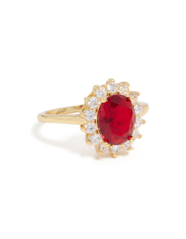 Stunning statement ring featuring oval cut red cubic zirconia with clear stones in a halo setting crafted from gold plated metal front view
