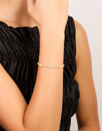 Experience a gold plated cubic zirconia flower toggle bracelet on wrist view - link has visual effect only