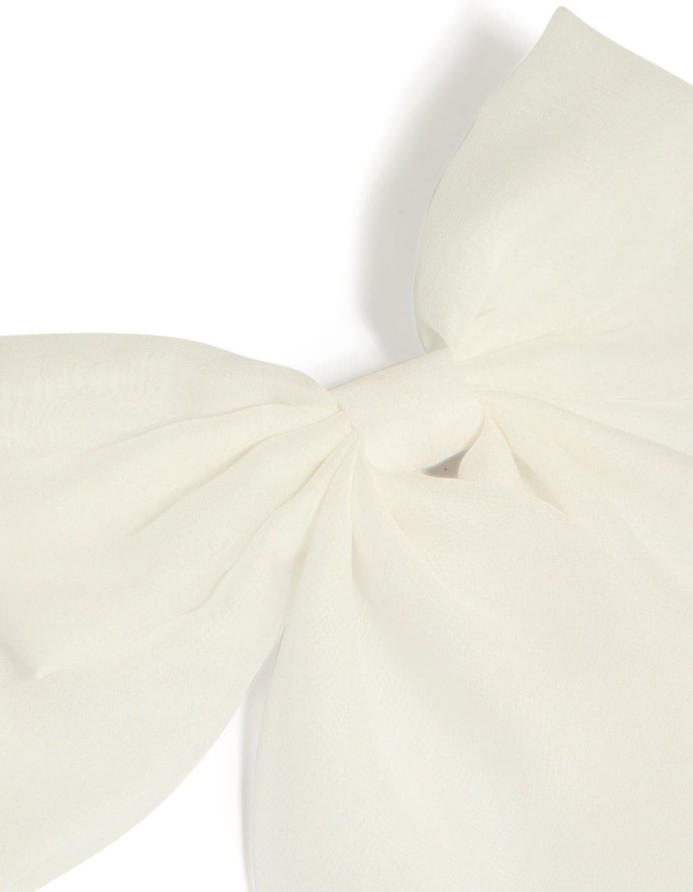 Showcasing a white fabric large bow clip in ivory with solid print detail view