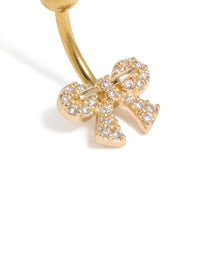 Highlighting a bow belly bar with cubic zirconia pavé, crafted from gold plated surgical steel design detail view - link has visual effect only