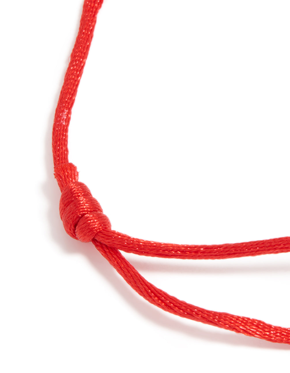 Highlighting a waterproof adjustable bracelet with gold plated stainless steel and red cord closure detail view