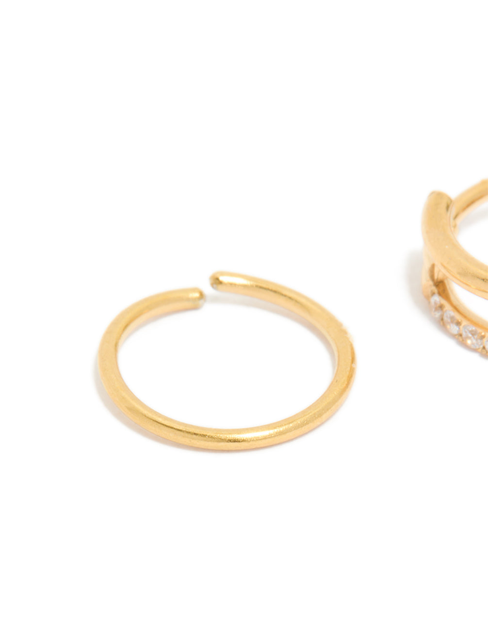 Close-up view of gold plated surgical steel nose rings with cubic zirconia in a 2-pack close up view
