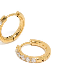 Crafted from stainless steel, these chunky gold plated hoop earrings feature cubic zirconia inlay post detail view - link has visual effect only