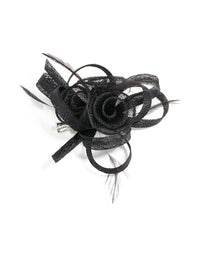 Crafted from black sinamay fabric, this floral hair clip features a swirl and feather design front view - link has visual effect only
