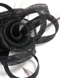 This black sinamay fabric floral hair clip features a swirl and feather design, detail view - link has visual effect only