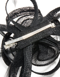 This black sinamay fabric floral hair clip features a swirl and feather design, detail view - link has visual effect only
