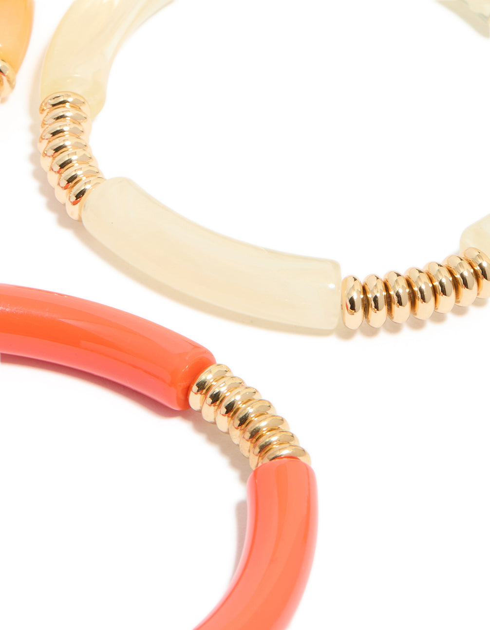 Showcasing brown and pink acrylic stretch bracelets in a 4-pack with gold accents close up view
