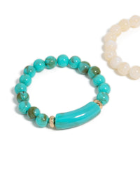 See this turquoise and neutral beaded stretch bracelet 2-pack featuring gold accents in close up view - link has visual effect only