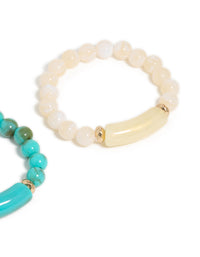 See this turquoise and neutral beaded stretch bracelet 2-pack featuring gold accents in close up view - link has visual effect only