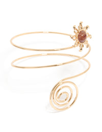 Showcasing a gold sun and swirl arm cuff featuring celestial design front view - link has visual effect only