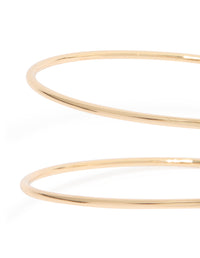 Gold sun and swirl arm cuff with celestial design close up view - link has visual effect only
