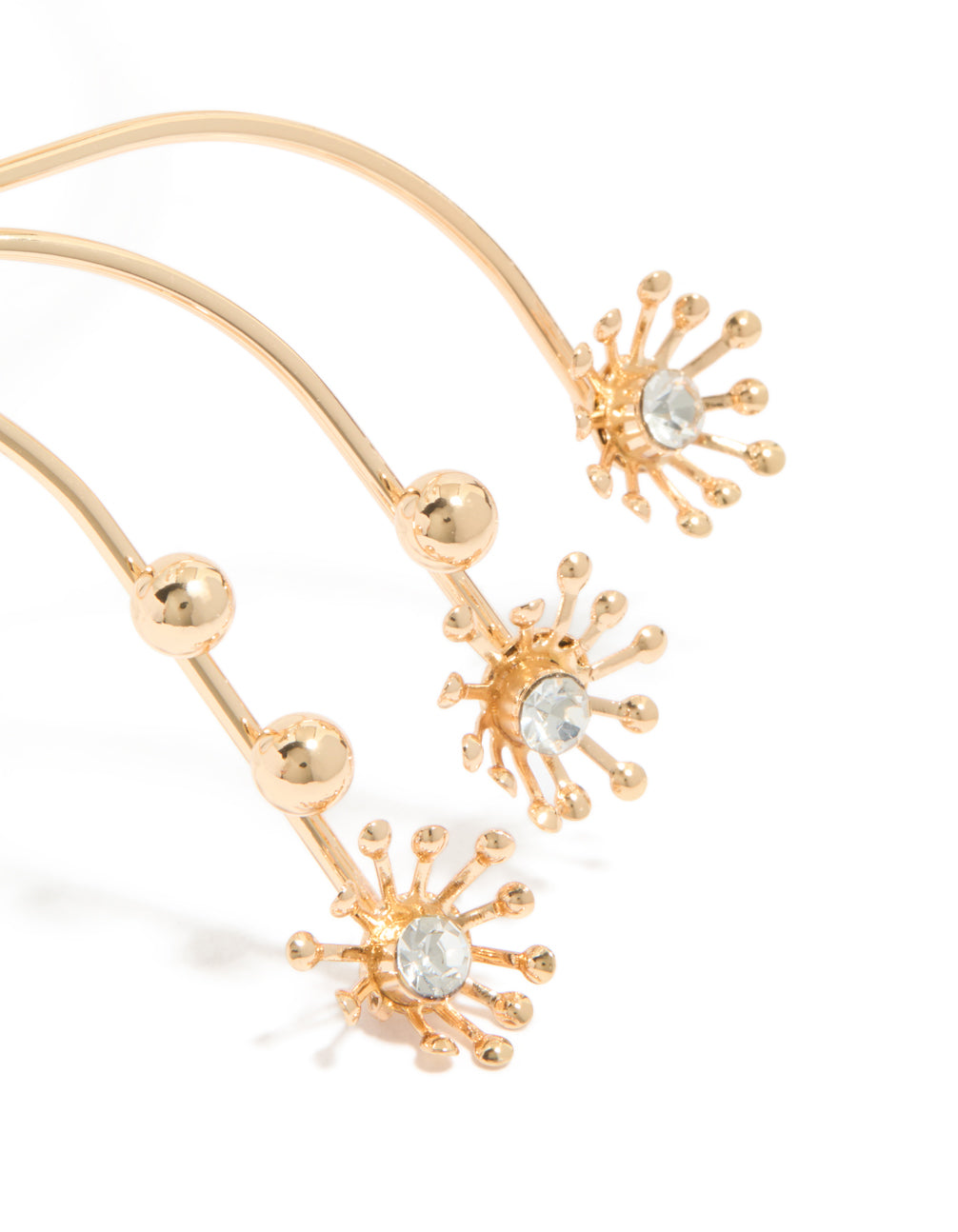 Showcasing diamante small flowers arm cuff in gold with ball feature close up view