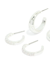 Crafted from silver plated material, cubic zirconia and smooth hoop earrings 2-pack with crystal accents close up view - link has visual effect only