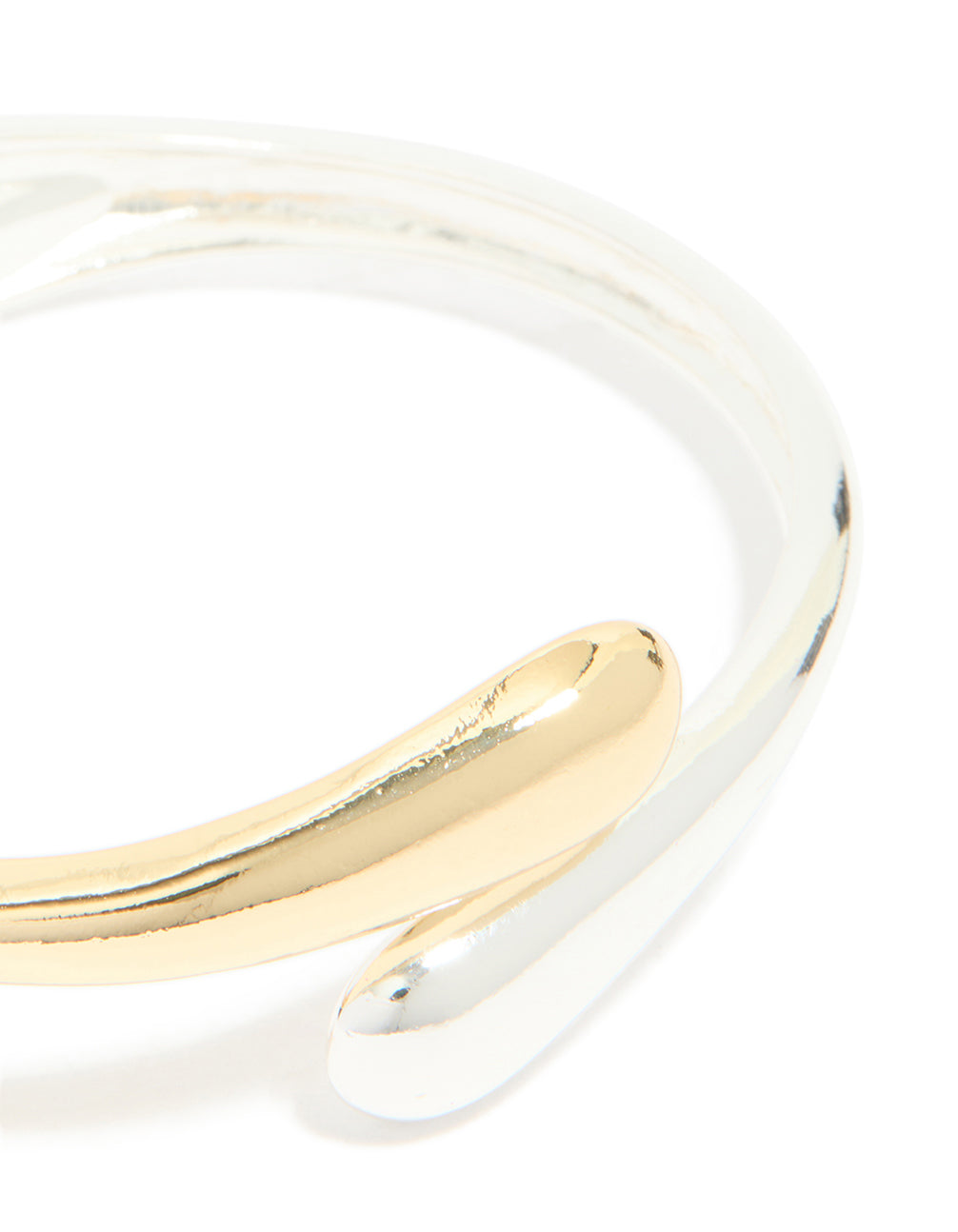 Featuring a mixed metal plated wrap around bangle in gold and silver in close up view