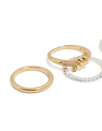 Featuring mixed metal plated cubic zirconia knotted textured rings 4-pack with beads and charm in gold, silver, clear and pink stone close up view - link has visual effect only
