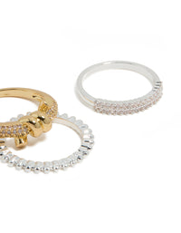 Featuring mixed metal plated cubic zirconia knotted textured rings 4-pack with beads and charm in gold, silver, clear and pink stone close up view - link has visual effect only