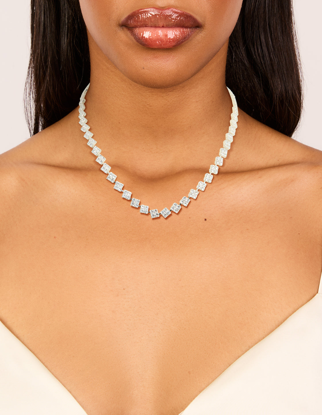 Elegantly designed silver plated cubic zirconia multi flower necklace in statement style on neck view
