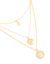 Showcasing is this gold plated layered necklace with cubic zirconia, evil eye and circle pendants close up view - link has visual effect only