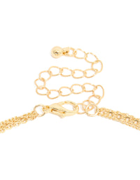 Highlighting the gold plated layered necklace with cubic zirconia, evil eye, and circle pendants clasp detail view - link has visual effect only