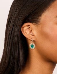 Showcasing gold pink and green diamante dainty huggie earrings in a 2-pack with clear accents on ear view - link has visual effect only
